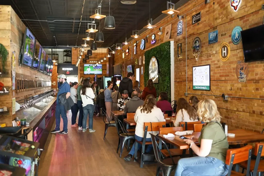 Guests at the bar and tables inside 1106 Tower Ave in Superior, WI